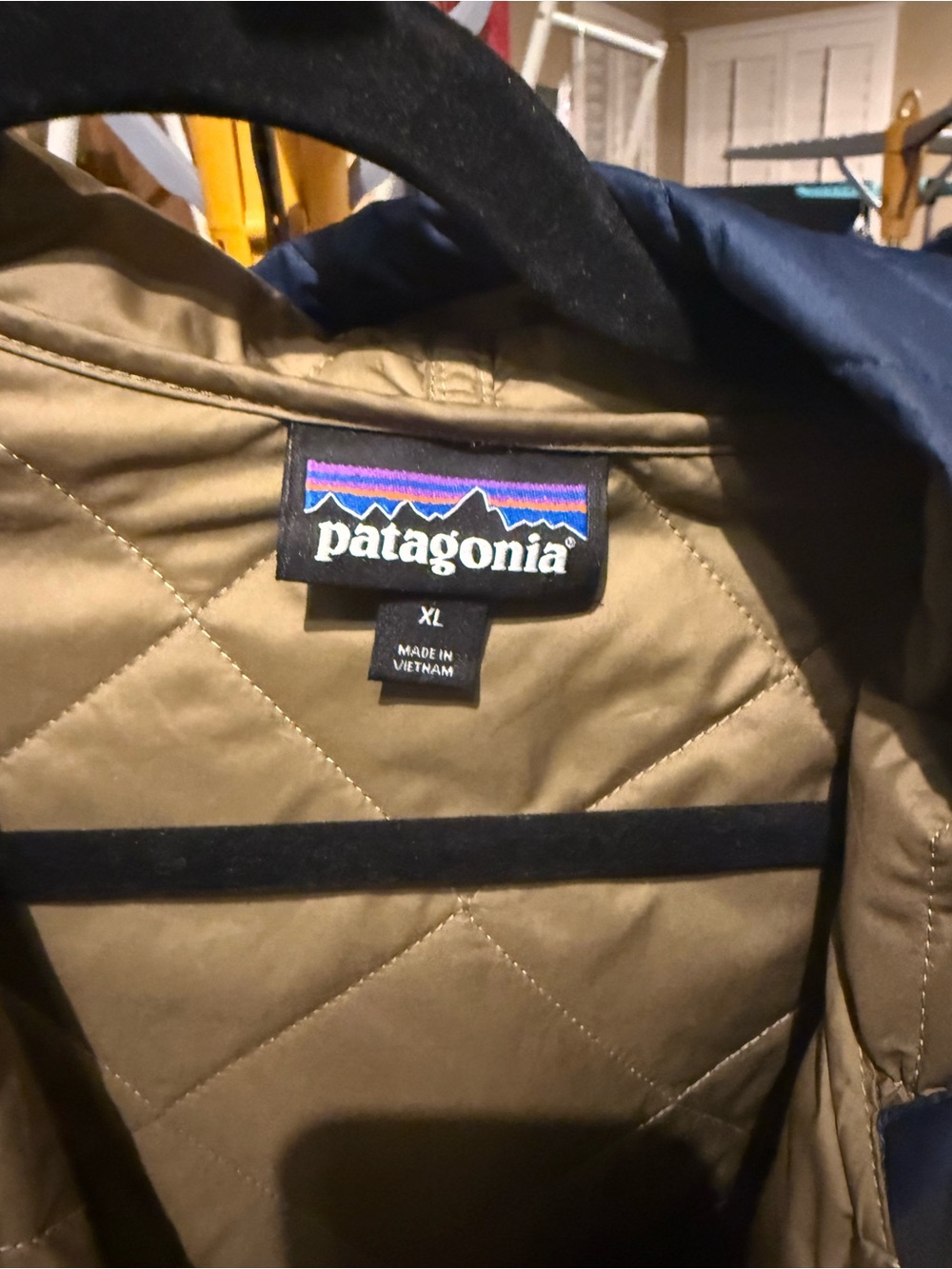 Patagonia Quilted Hooded Bomber Jacket in Navy with Tan Lining - Picture 3 of 4